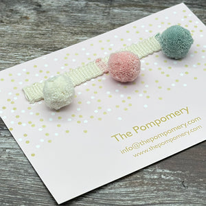 duck egg, ivory, and candy pink pompom trim on plain braid Sample card