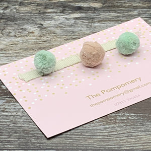 This is a dUll colour pompom trim, combining our Sea Foam, and Warm Blush Pink poms on an plain braid Sample card