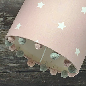 Pink twinkle fabric lampshade with pompom trim 