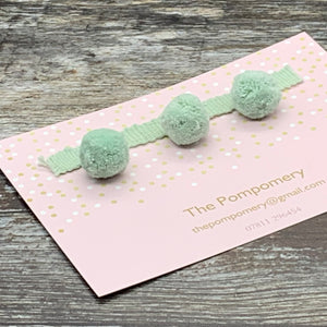 This is our plain sea foam pompom trim on matching braid Sample card