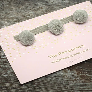 This is our plain linen pompom trim on matching braid Sample card